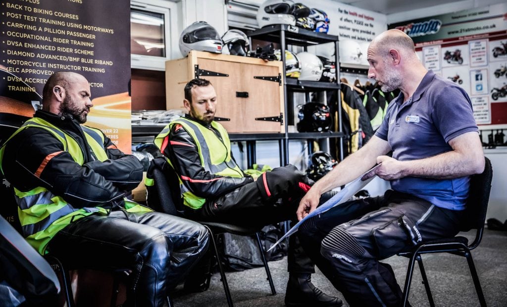 Students learning in the Chippenham motorcycle training centre classroom .