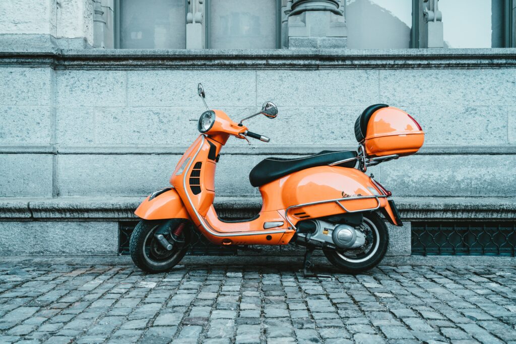 Orange scooter in Europe needs a scooter licence to ride on the road or a CBT certificate to ride on UK roads